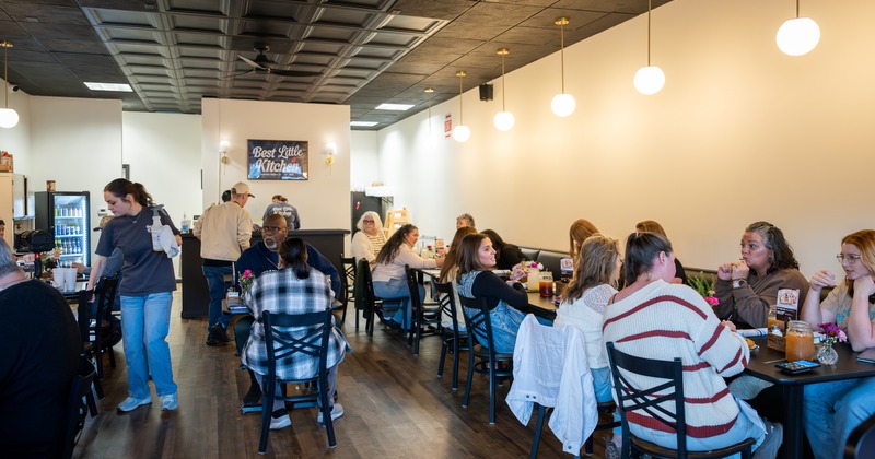Interior,  diner area, wide view, full of people