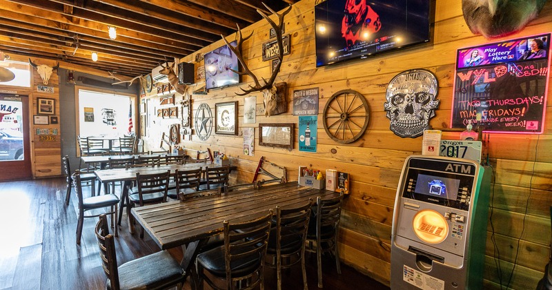 Cozy and rustic interior seating area with wooden tables and chairs