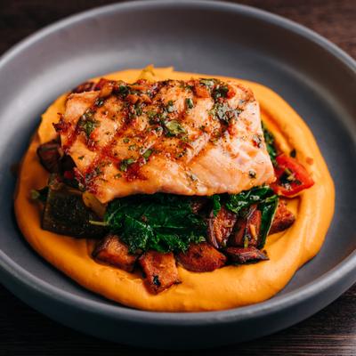 Grilled Salmon* (GF, VA) img Roasted Sweet Potatoes, Grilled Peppers, Kale, Carrot-Tahini Puree, Smoked Paprika Vinaigrette.