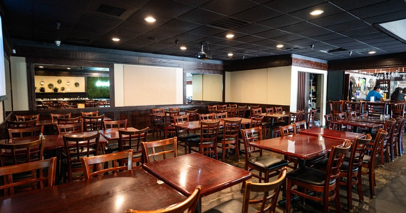 Interior, wide view of dining area, tables and chairs