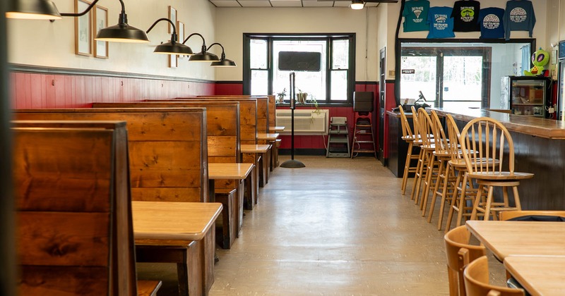 Interior, seating area, bar on the right, booth area on the left