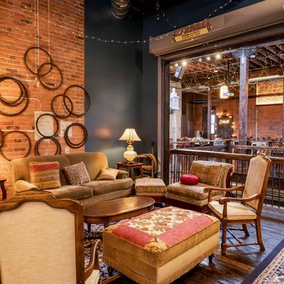 Interior, lounging area, sofas, chairs, ottoman and coffee table