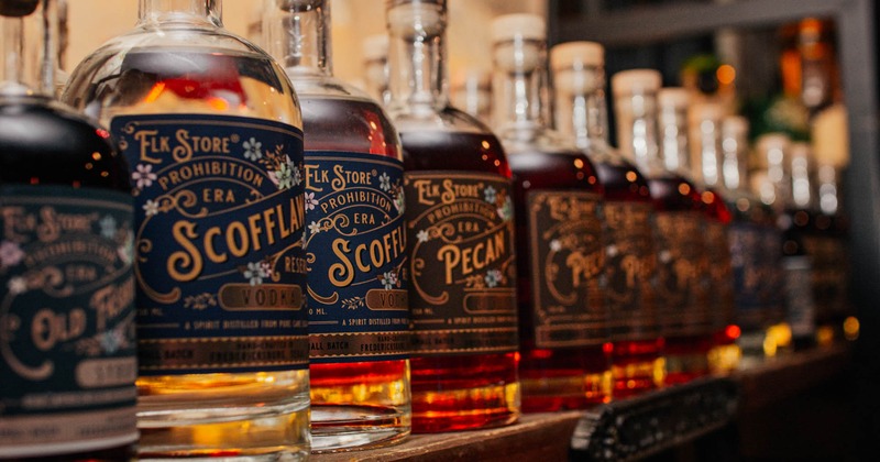 A line of spirits on a bar shelf