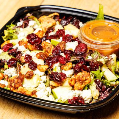 Cranberry Apple Walnut Salad served with dressing on the side.