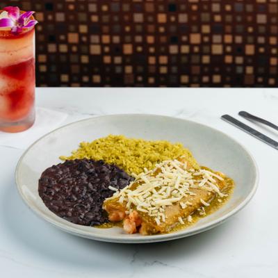 Green shrimp enchiladas with cheese, refried black beans, rice, and a cocktail.