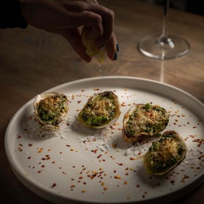 Oysters Rockefeller, served