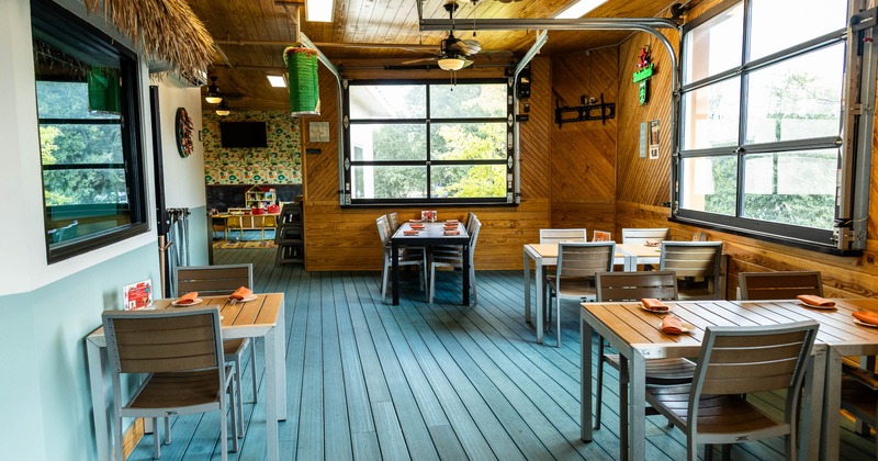 Interior, dining area with tables set for guests