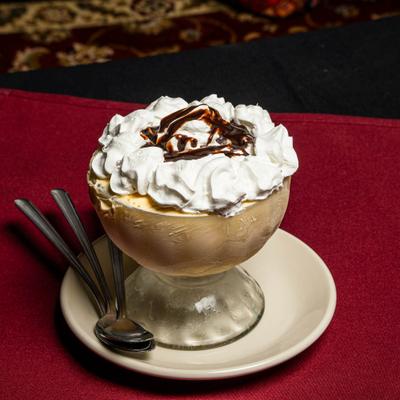 Ice cream, topped with whipped cream.