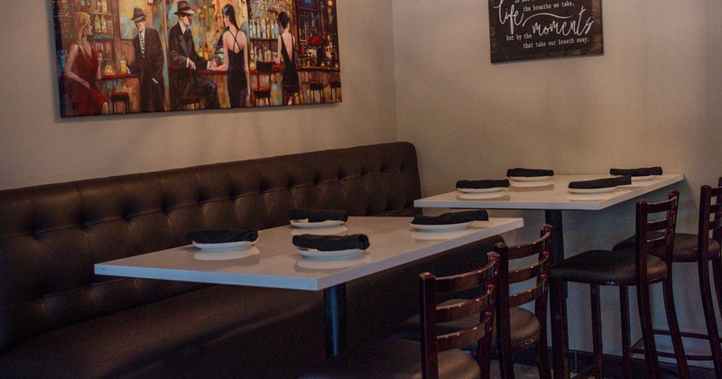 Interior, tables set for guests,  dining area