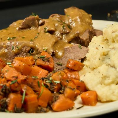 Pot roast with mashed potatoes and carrots.