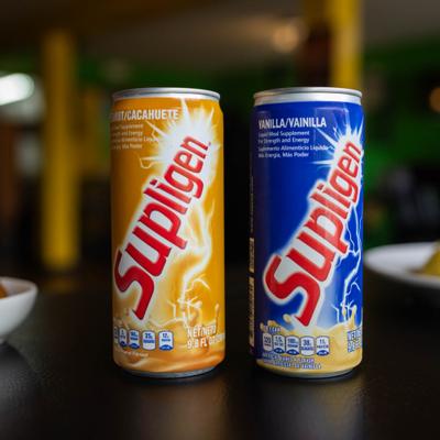 Two cans of Jamaican milk-based nutritional liquid meal.