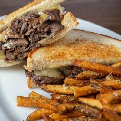 Brisket sandwich with fries.
