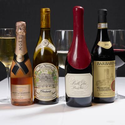 Various bottles of red, white and sparkling wine served on the table.