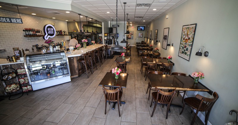 Interior, seating area and bar area on the left, front view