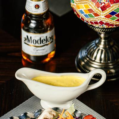 Garden Salad with dressing, and a bottle of Modelo beer.