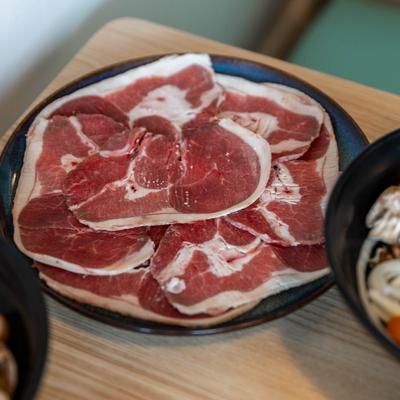 Sliced meat on a plate, closeup.