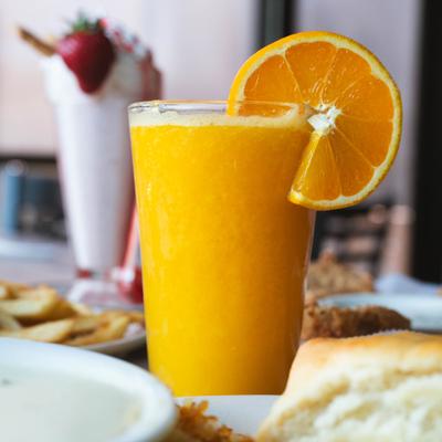 A glass of orange juice.