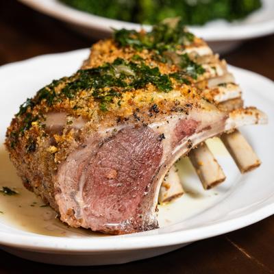 Rack of lamb, served on the table.