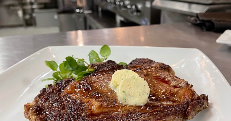 Grilled ribeye steak with butter