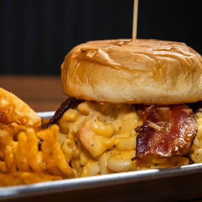 Crispy chicken and bacon sandwich topped with creamy macaroni and cheese.