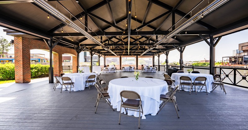 Covered patio with tables and chairs