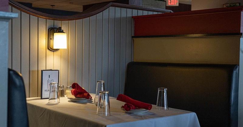 Interior, dining booth with a set table