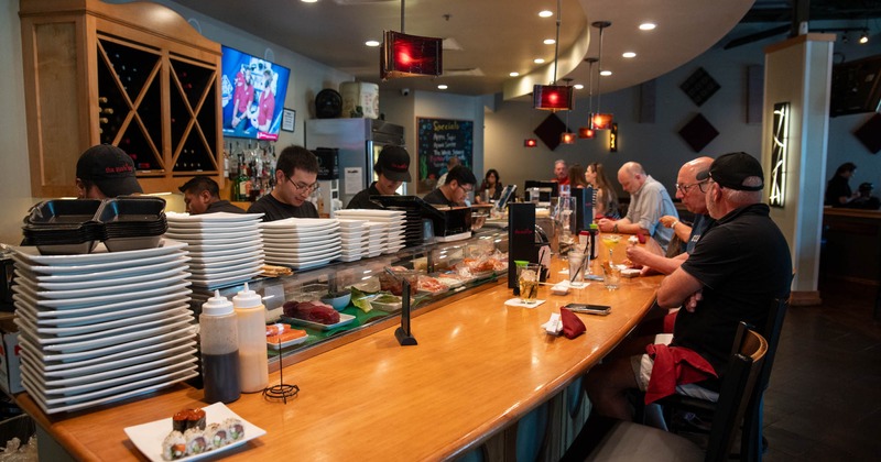 Bar, guest, drink rack, tv's above