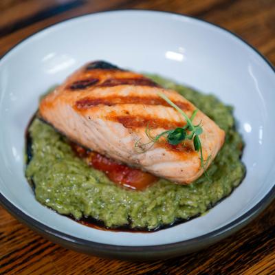 Grilled salmon over spiced spinach curry.