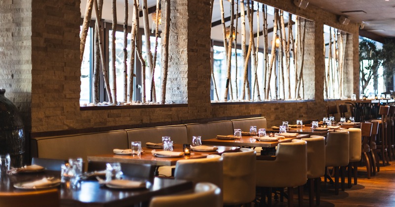 Restaurant interior, dining area with set dining tables