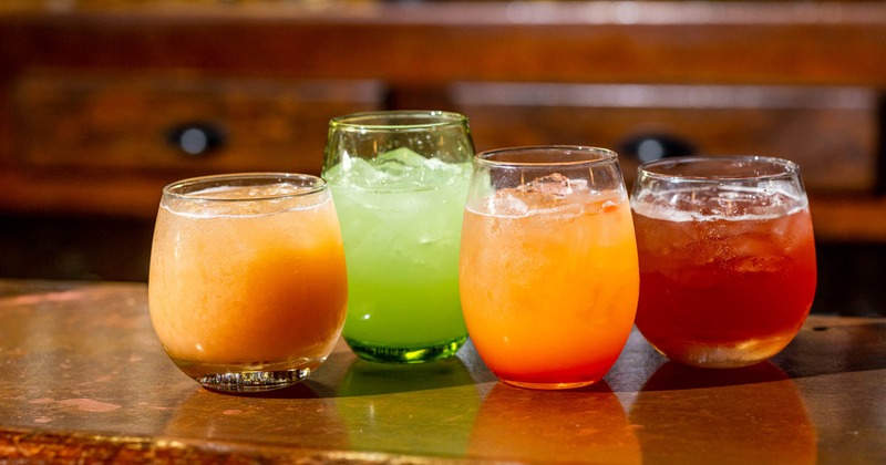 Assorted refreshing fruit drinks served in glasses