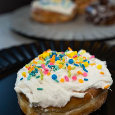 Sprinkles Cream Donut, close-up.