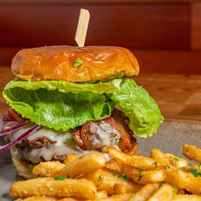 California Cheeseburger with bacon, Swiss cheese, and guacamole.