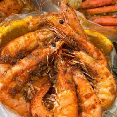 Cajun seafood boil with head-on shrimp.