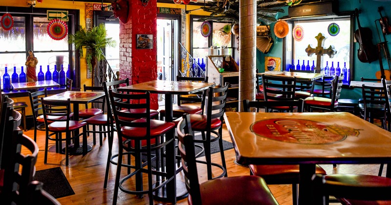 Interior, tables and seats, traditional decorations on the ceiling and around the room