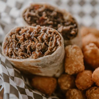 Steak wraps with tater tots.