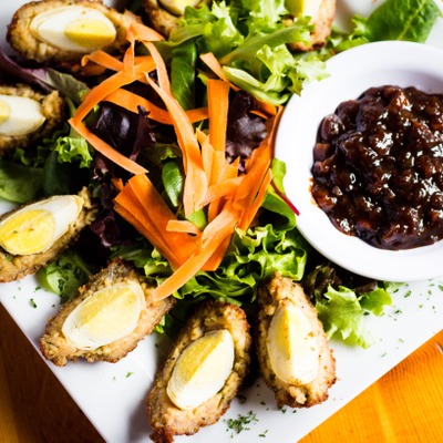 Traditional scotch eggs served with a pickled relish, mustard & salad