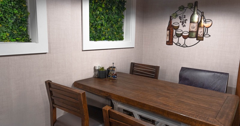 Interior, wooden table with chairs, wall decoration