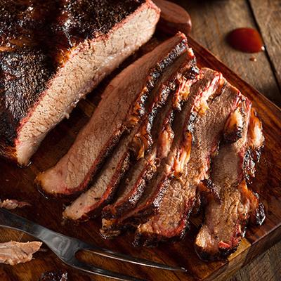Sliced brisket on a wooden board