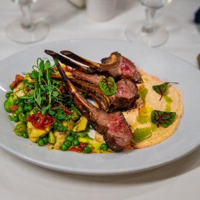 Lamb chop, served on a plate.