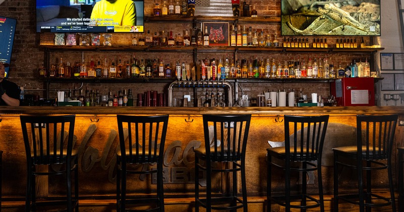 Bar area, neatly lined up bar stools