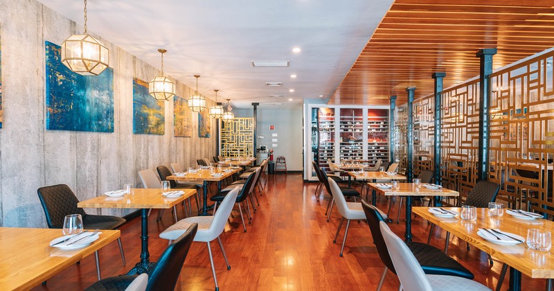 Interior, tables with tableware and chairs lined up