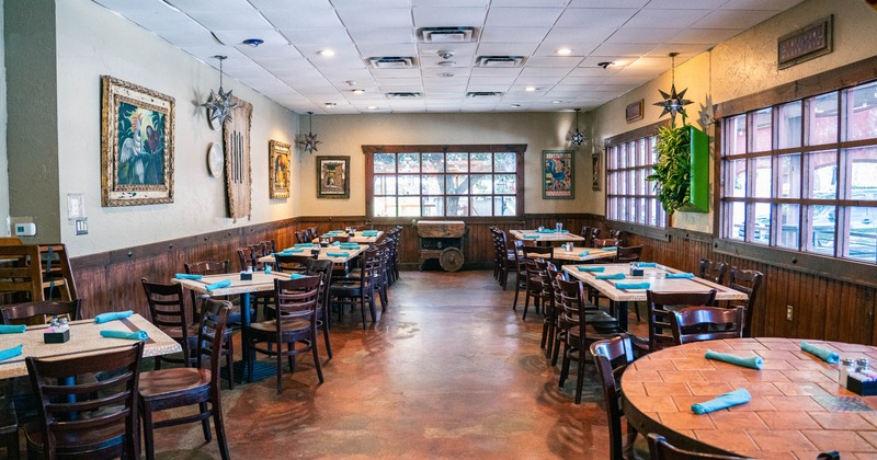 Interior, tables and chairs in dining area