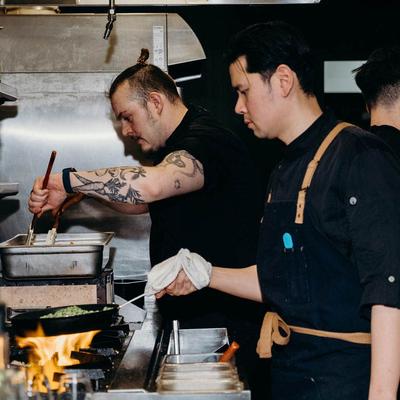 Chefs preparing dishes.