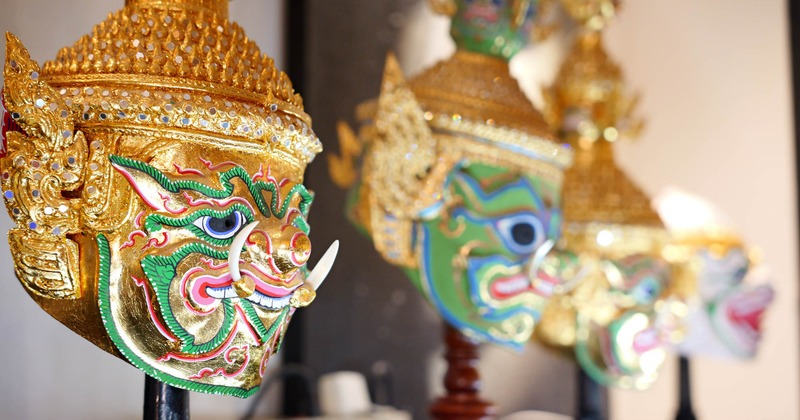 Traditional masks hanging above the dining tables