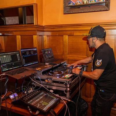 A DJ performing indoors.