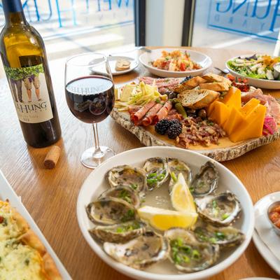 Various food and wine on the table.