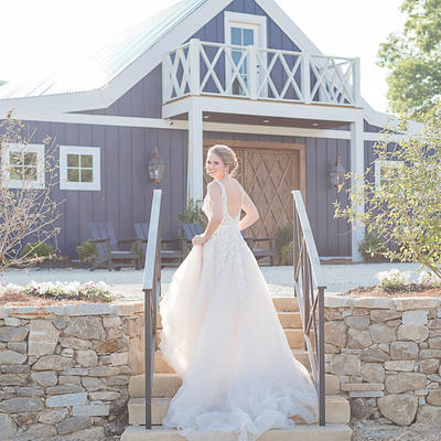 Girl in the wedding dress posing for a photo