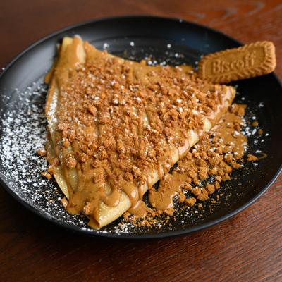 Lotus Crepe featuring Lotus Biscoff spread, powdered sugar and cookie crumbs..