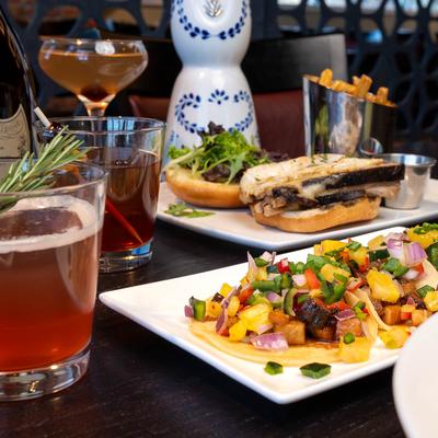 Assorted dishes and drinks arranged on a table.