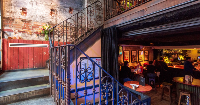 Interior, staircase and seaing area with guests